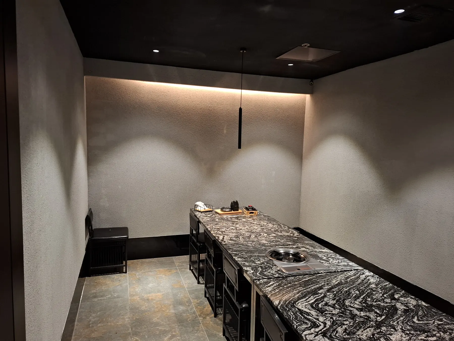 A private room with a built-in pot burner